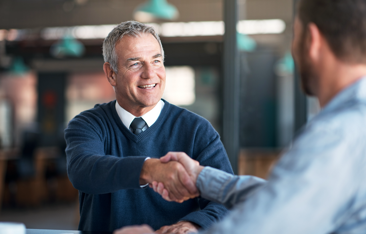 Consultant welcoming a new client